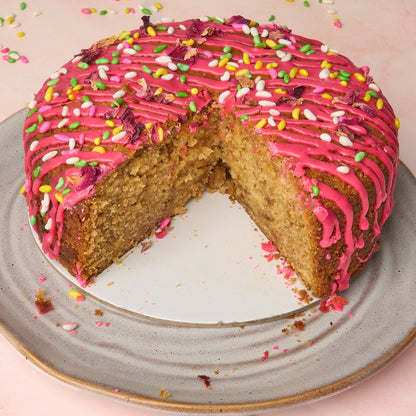 Rose gulkand cake cut open showing moist, soft crumb and slightly dense texture