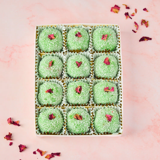 Rose Gulkand Filled Coconut Laddoo 12 piece gift box in Australia with green coconut coating, dried rose petals and nut filled centre, premium sweet gifting