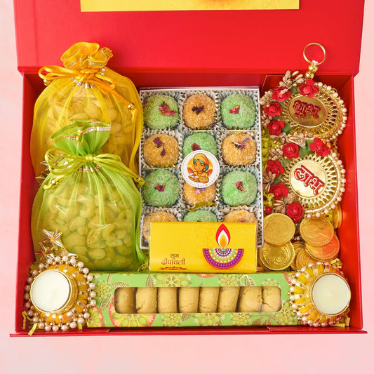 Saugaat luxury Diwali hamper with laddoos, nankhatai, roasted nuts, chocolate coins, diyas and Shubh Labh wall hangings