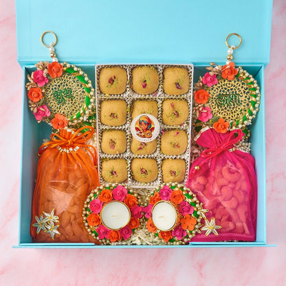 Shagun Indian gift hamper with laddoos, roasted nuts, handmade diyas and Shubh Labh wall hangings
