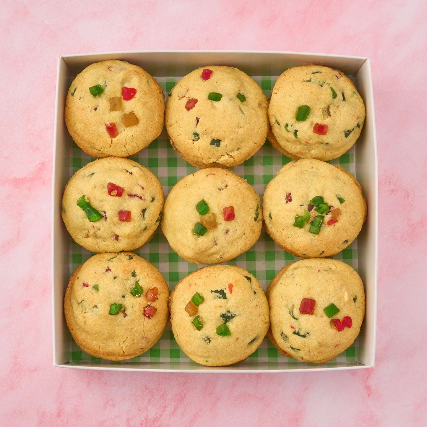 Tutti frutti cookies with candied fruit arranged in an 18-cookie box