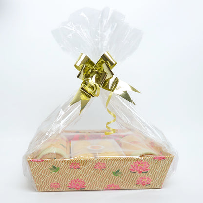 Wrapped Uphaar Indian sweets gift tray ready for gifting with clear wrap and ribbon
