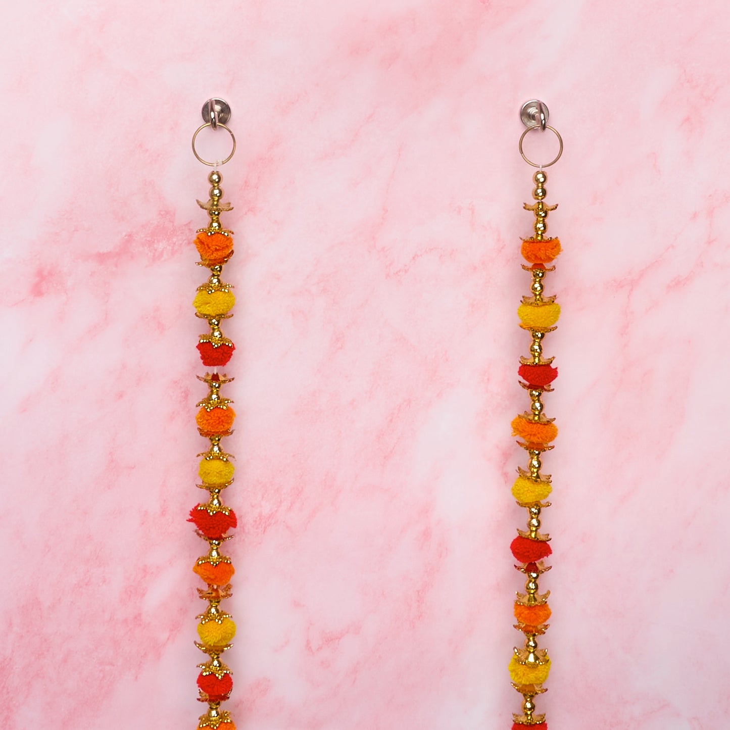Wall hangings with orange, yellow and gold decorative details
