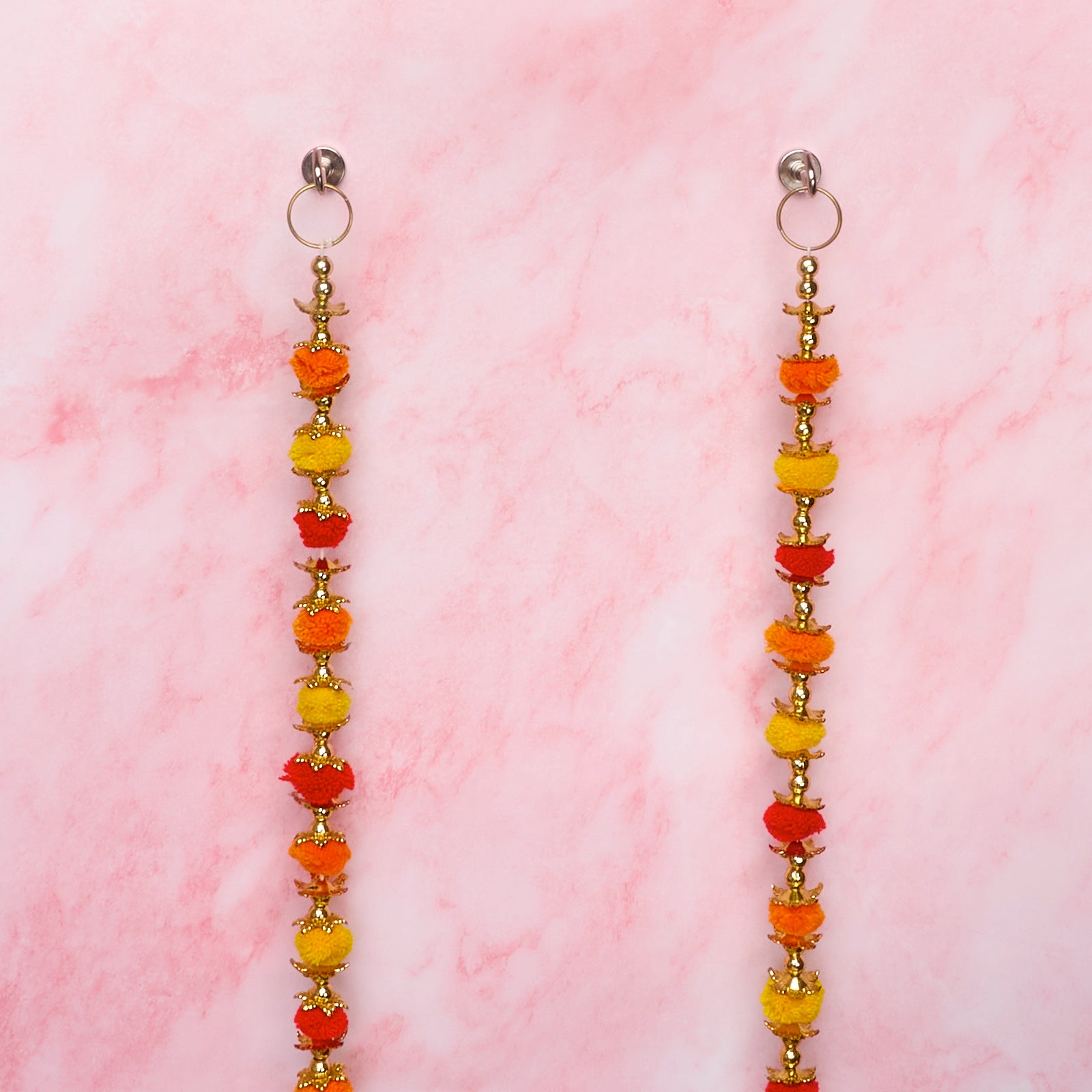 Wall hangings with orange, yellow and gold decorative details