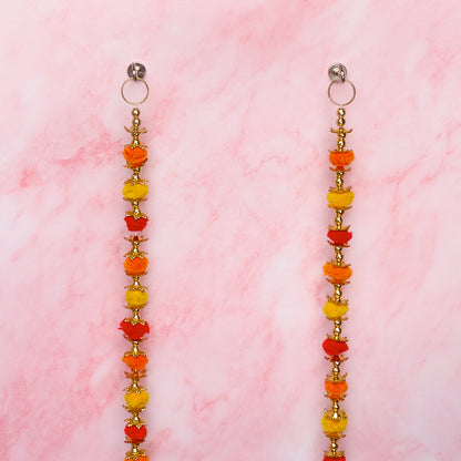 Wall hangings with orange, yellow and gold decorative details