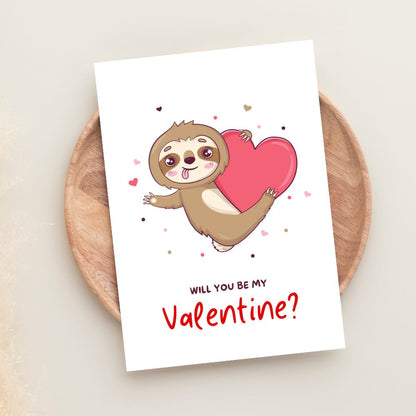 Will You Be My Valentine greeting card with cute sloth holding heart illustration